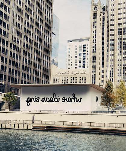 dusable bridge white concrete building near body of water michigan avenue